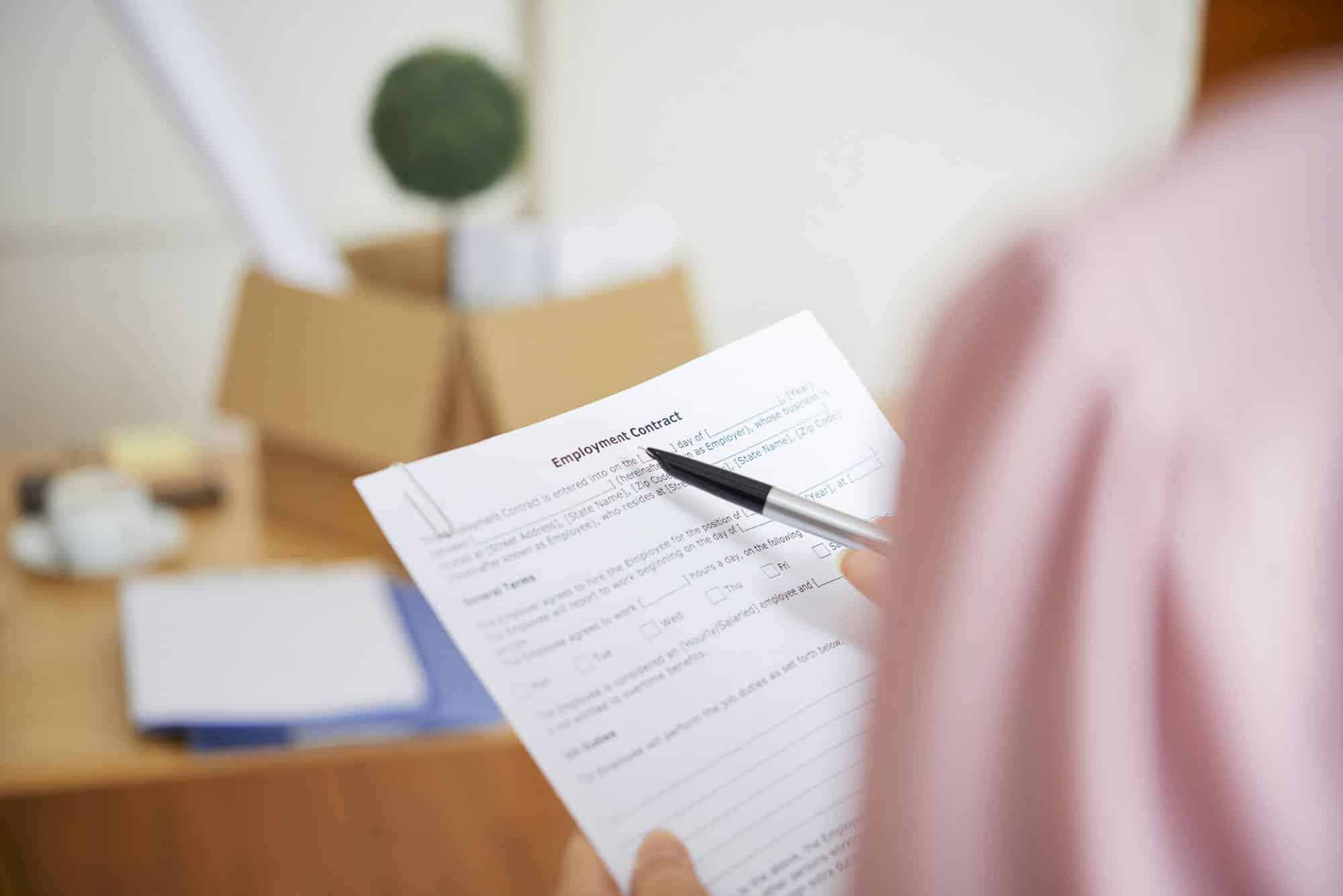 Businesswoman reading employment contract